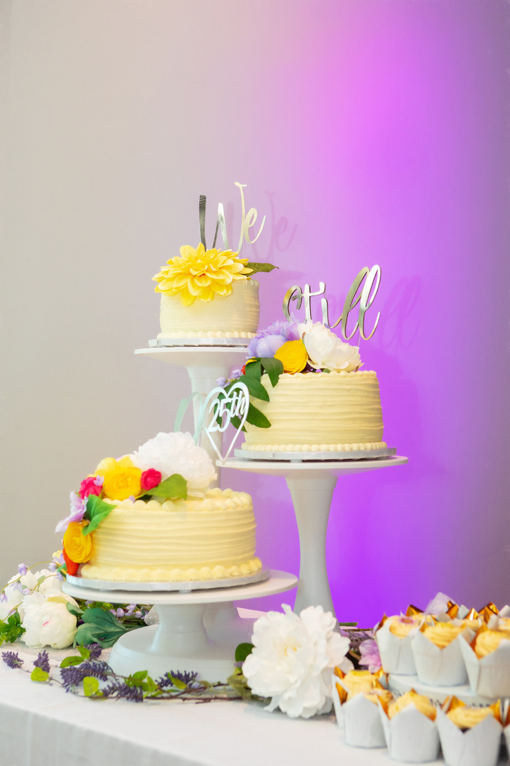 Elegant decorated cakes displayed at a wedding celebration